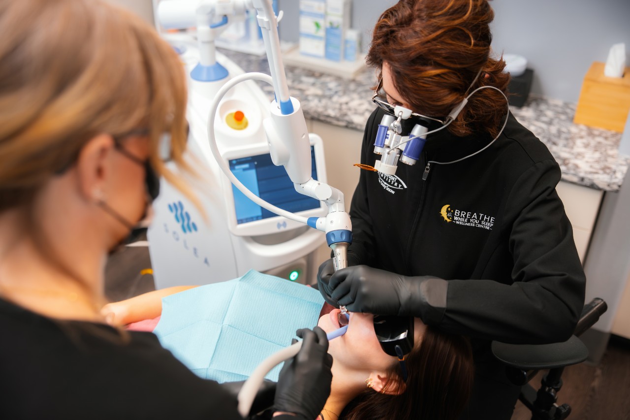 Dr. Snow performing a needle-free procedure